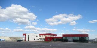 Milionară din afaceri cu statul, firma unui urmărit internațional nu a plătit redevența pentru sediul din Parcul Industrial Miroslava